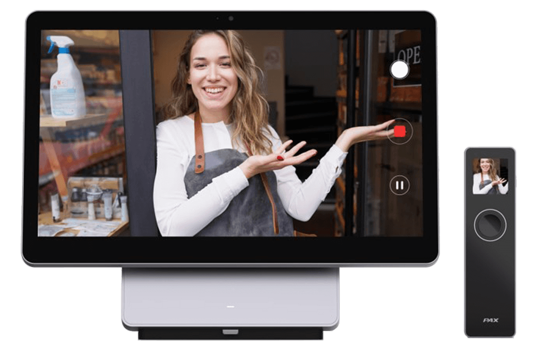 The Elys Workstation and the Elys Eye taking video of a woman standing in the door of a shop holding her hand up to the side with her palms up.