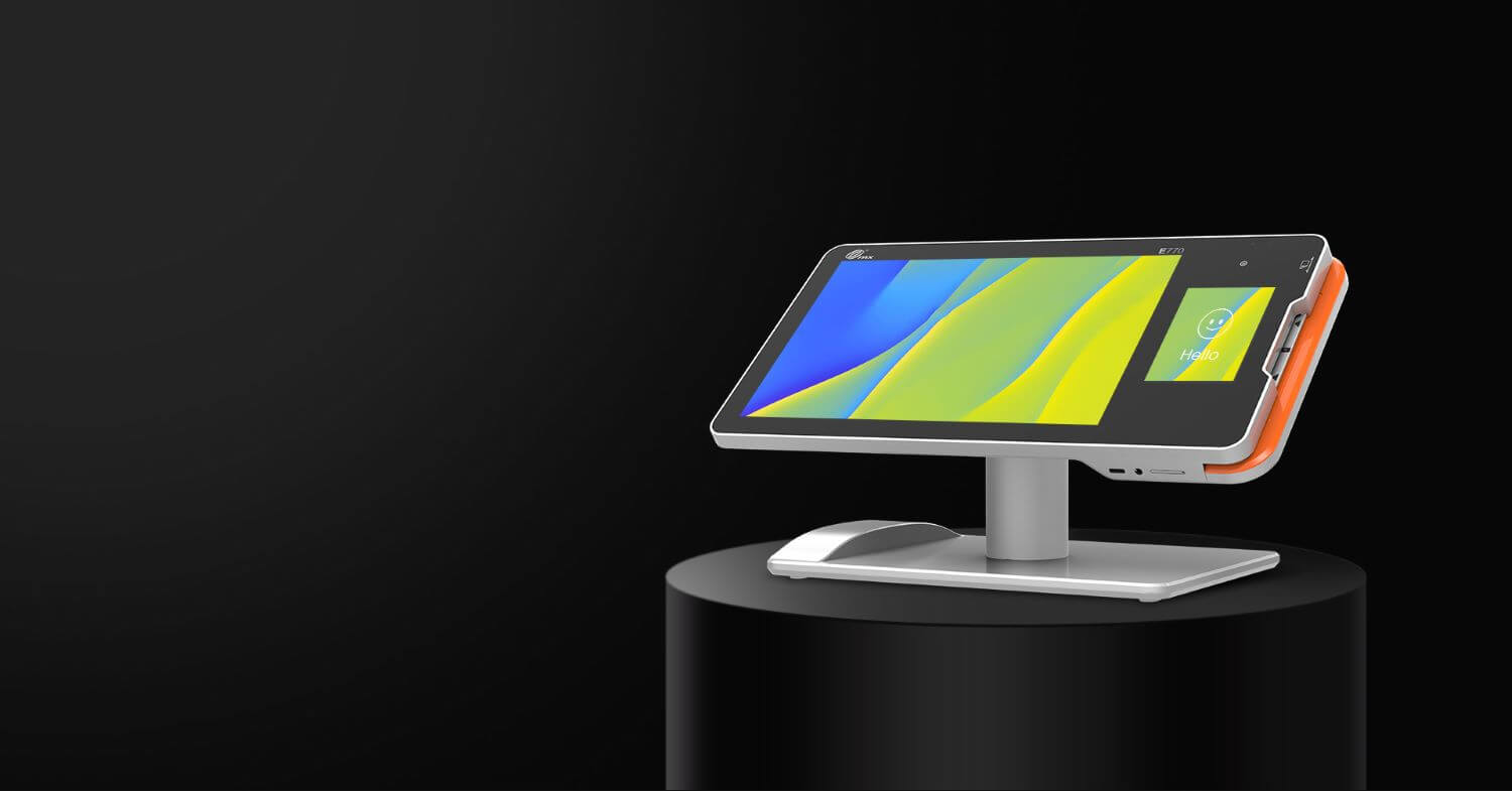 payment terminal with a blue and yellow screen saver that is angled left on a circle pillar with a black background